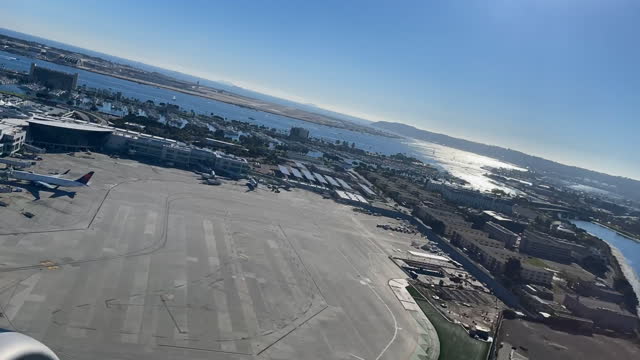 Time Lapse Passenger Jet Taking off from San Diego Airport over the bay in the Pacific Ocean