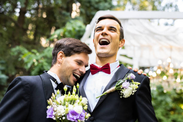 Gay couple celebrating their wedding Homosexual couple celebrating their own wedding - LBGT couple at wedding ceremony, concepts about inclusiveness, LGBTQ community and social equity civil partnership stock pictures, royalty-free photos & images