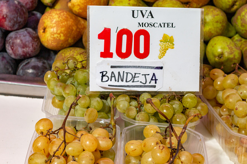 White Grapes at Mercado Central (Central Market) in Valencia, Spain, with an illustration of a bunch of grapes