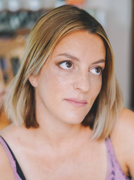 istock Middle-aged woman getting makeup done by a professional 1362958375