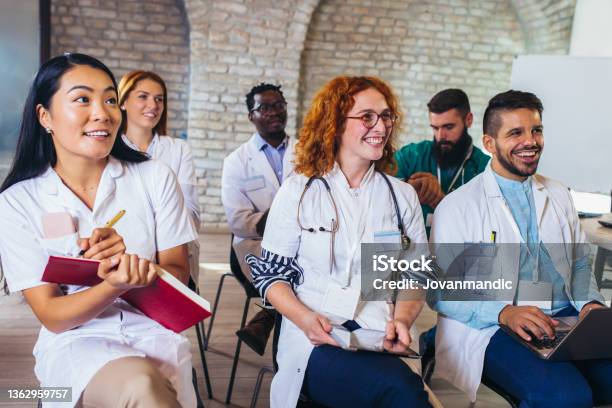 Group Of Happy Doctors On Seminar In Lecture Hall At Hospital Stock Photo - Download Image Now