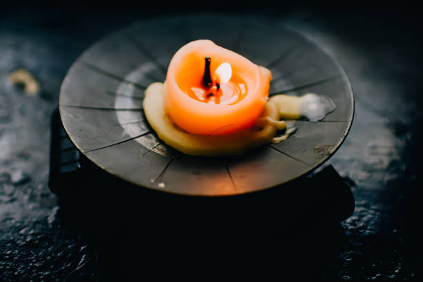 istock black background with burning vintage candle 1362961463
