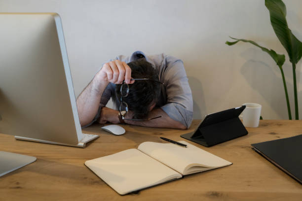 istock Businessman looking stressed out while working in an office 1362961512