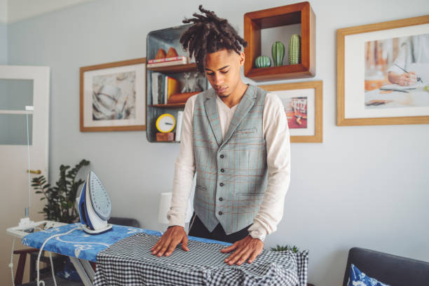 istock Young man ironing his shirt 1362961672