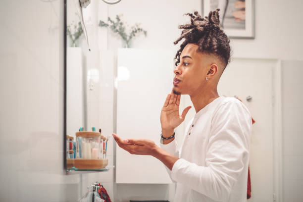 istock At home - young man brushing his teeth 1362964198