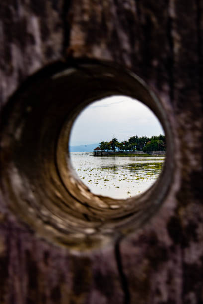 istock Looking a cape from a hole in the wall 1362966288