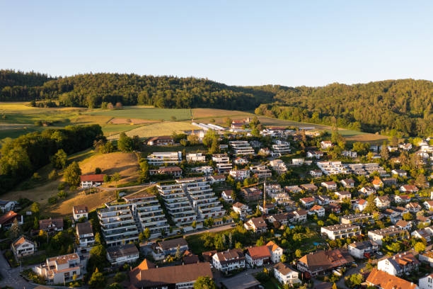 Amazing shot of a beautiful landscape in the alps of Switzerland. Wonderful flight with a drone over an amazing landscape in the canton of Aargau. Epic view at sunset over a village called Nussbaumen. Amazing landscape in Switzerland. aargau canton photos stock pictures, royalty-free photos & images