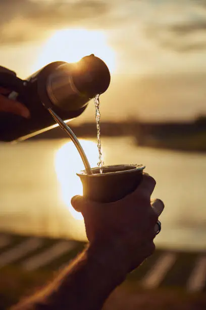 Photo of Drinking Argentinian Mate in a riverside.