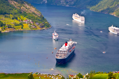 End of the famous Geiranger fjord, Norway with cruise ships