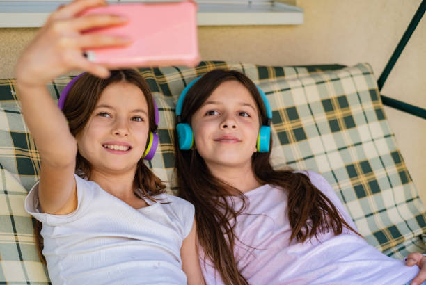 istock Girls photographing 1362969216