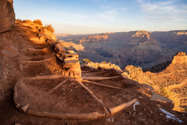 Empty Switchback of South Kaibab Trail Empty Switchback of South Kaibab Trail heading into the Grand Canyon winter sunrise mountain snow stock pictures, royalty-free photos & images