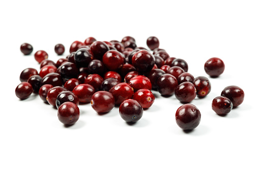 fresh red cranberries isolated on white background