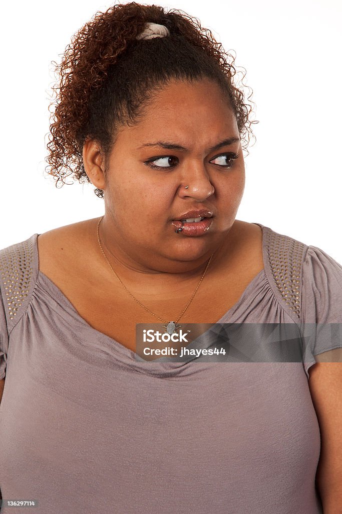 Sceptical Mixed Race girl Mixed race young woman expresses emotion Adult Stock Photo