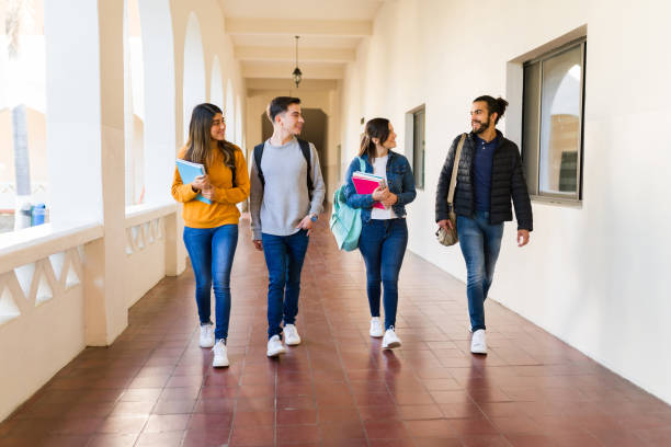 istock Multiracial friends walking to the library 1362971283