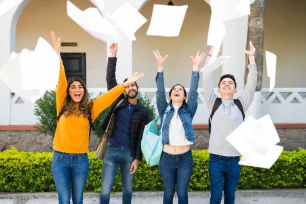 istock Smart friends graduating from college 1362972717