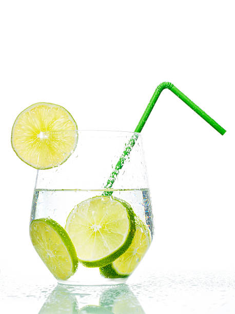 Glass with lime and green straw