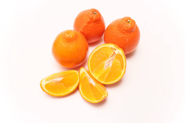 Pictured tangeloes in a white background.