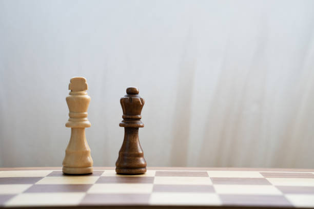 istock White king and black queen on chess board 1362977341