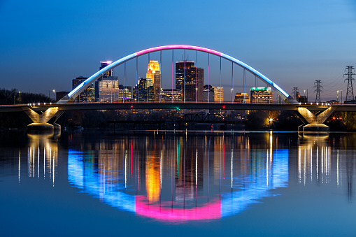 The colorful Lowry Avenue arch bridge in Minneapolis, Minnesota. The bridge normally displays blue lights but is lit in other colors for certain hollidays and events with its LED system.