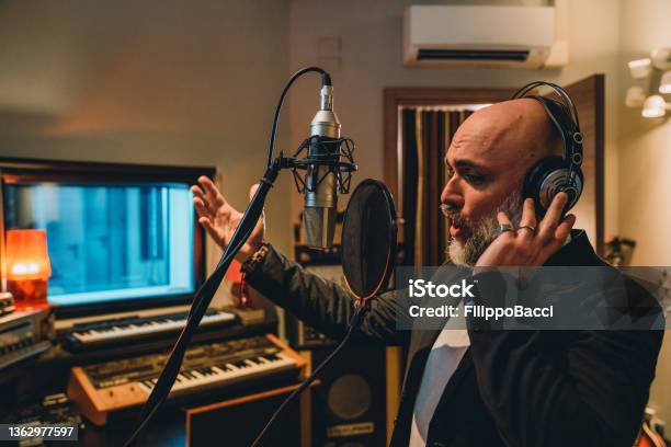 Singer Is Recording Music In A Professional Recording Studio Stock Photo - Download Image Now