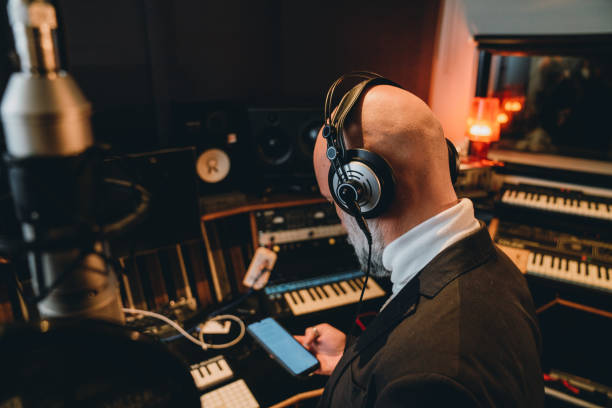istock Singer is recording music in a professional recording studio 1362977605