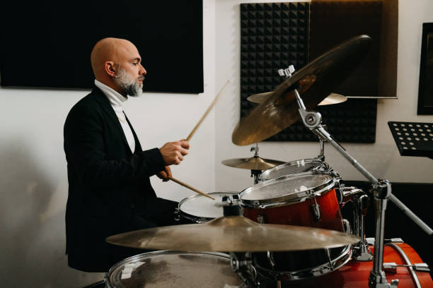 istock A man is playing drums in a professional recording studio 1362977690