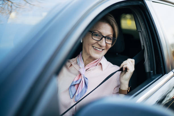 istock Mature woman in a car. 1362981499