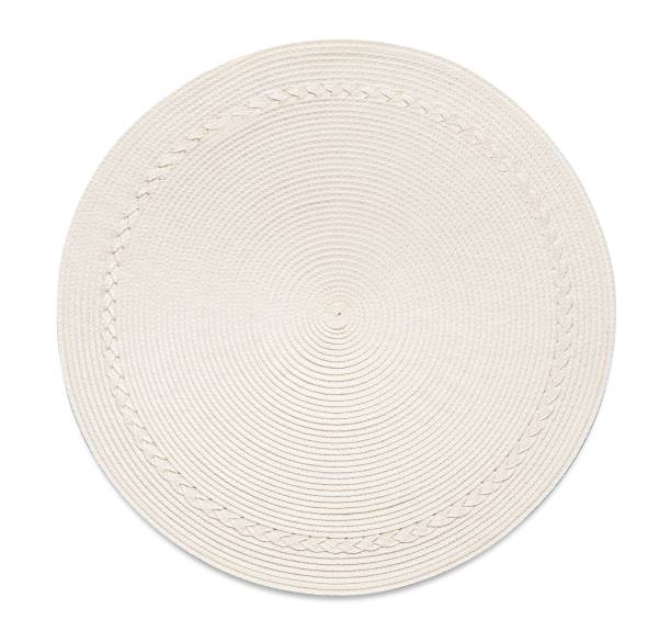 istock Top view of off-white round woven placemat, isolated 1362981764