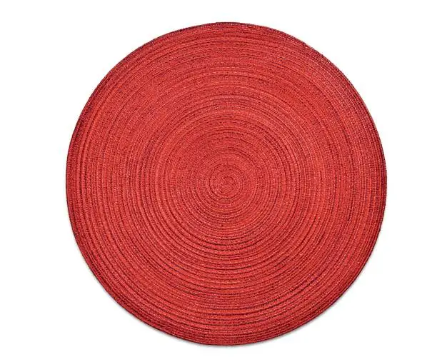 Photo of Top view of red round woven placemat, isolated