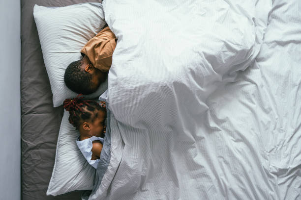 istock Top View of Siblings Sleeping in Bedroom 1362988722