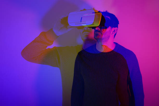 istock He is discovering metaverse by using VR glasses under neon lights 1362991486