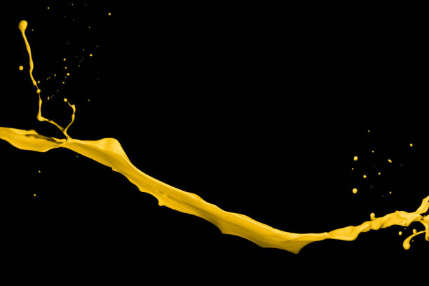 istock Yellow paint splashes, isolated on black background 1362992191