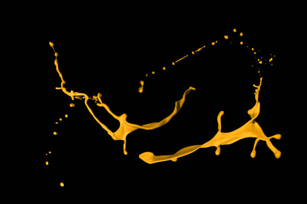 istock Yellow paint splashes, isolated on black background 1362992256