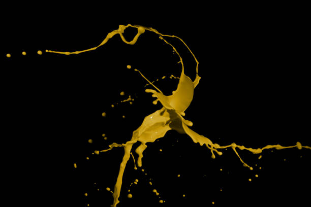 istock Yellow paint splashes, isolated on black background 1362992322