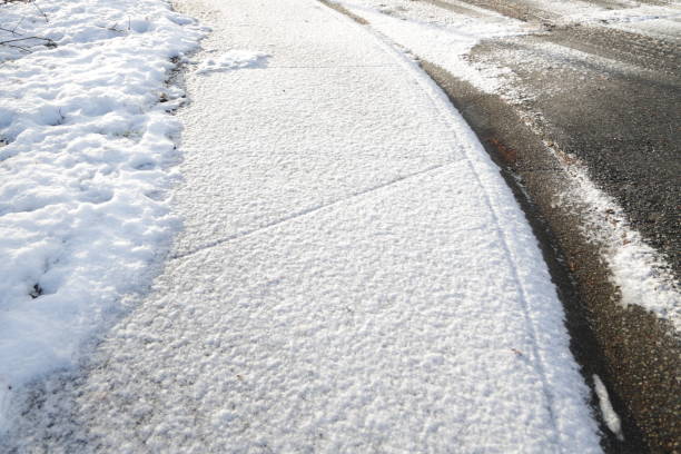 istock Light Snow on a Curved Sidewalk in Canada 1362992421