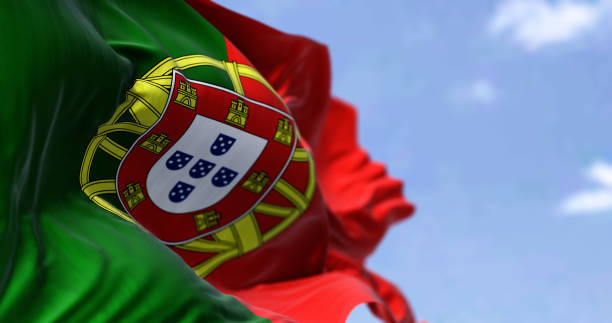 Detail of the national flag of Portugal waving in the wind on a clear day stock photo