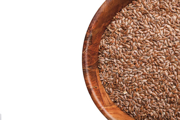 istock Flaxseed in wooden bowl isolated on white. 1363005699