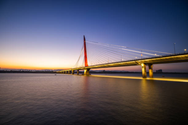 istock Nanchang Hero Bridge on the calm river in the sunset 1363007926