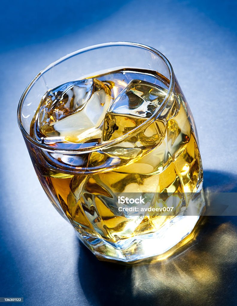 Whiskey on the rocks Whiskey on the rocks on the blue background. Adobe RGB Alcohol - Drink Stock Photo