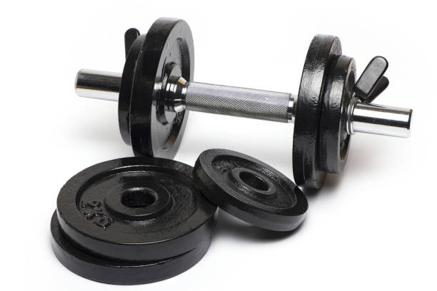 istock Closeup dumbbell black weight plates white background 1363022188