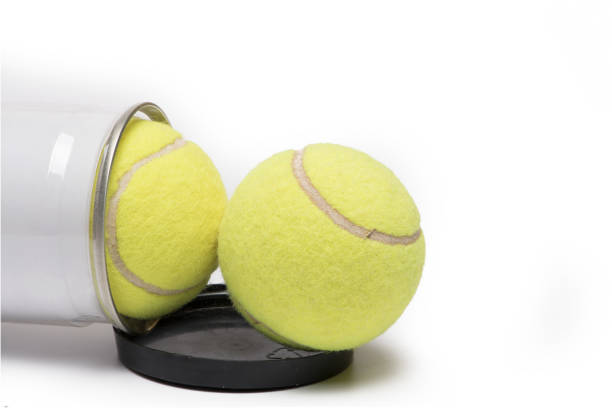 istock two tennis balls open tray white background 1363022869
