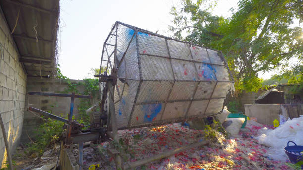 istock Recycle machine with stack of different types of large garbage dump, plastic bags, and trash bins in urban area in Environmental pollution concept. 1363027543