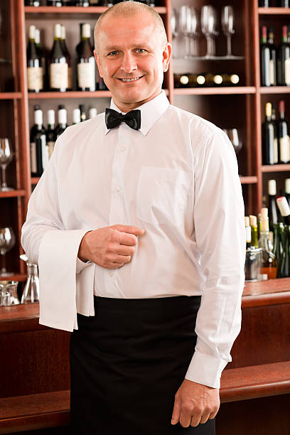istock Wine bar waiter mature smiling in restaurant 136303094