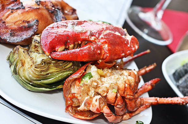 istock Red lobster with artichoke. 136303242