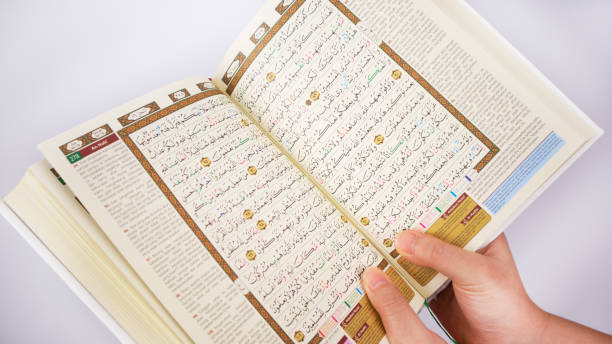 istock Hands Holding an Open Holy Quran From Above 1363032437