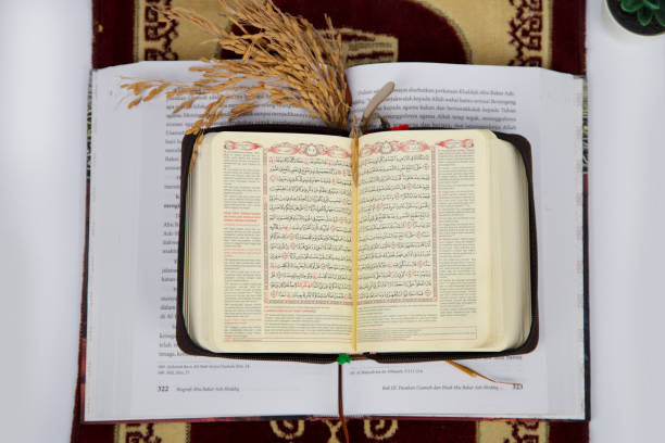 istock Holy Quran Opened on Top of a Book 1363032486
