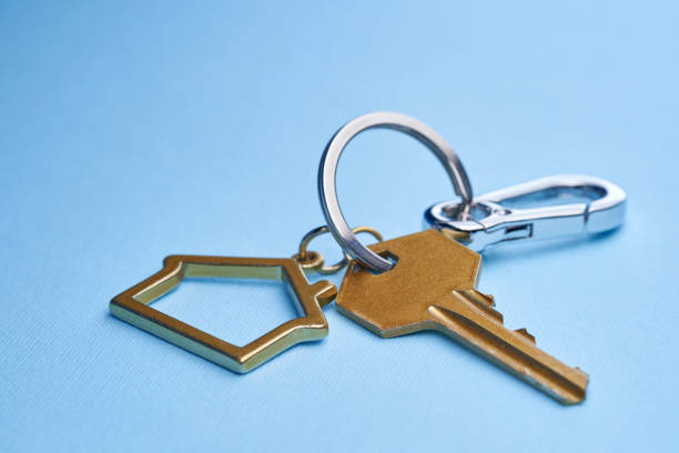 istock House shaped keychain against blue background 1363032525