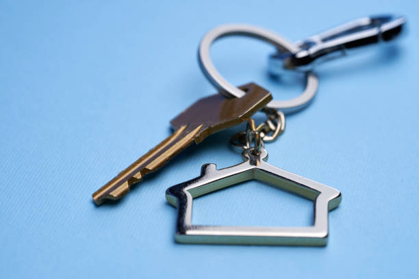istock House shaped keychain against blue background 1363032526