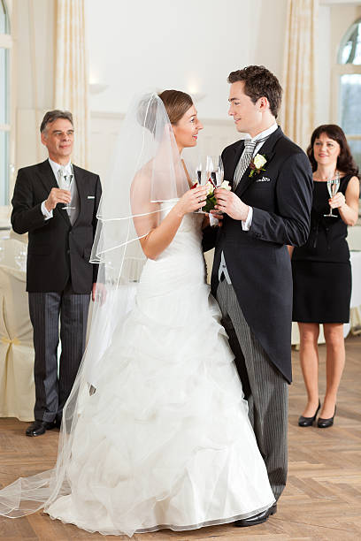 istock Bridal couple clinking glasses 136303532