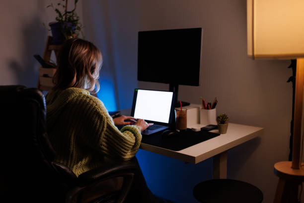istock Young woman working late from home 1363037379